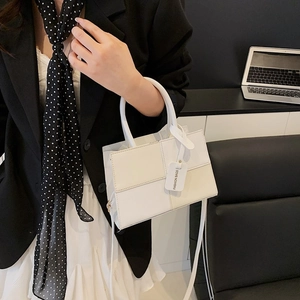 Retro two-tone patchwork tote bag with top handles and shoulder strap in white and beige