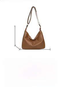 Detailed view of brown PU leather tote bag dimensions 33x22x9cm and adjustable strap