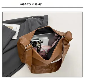 Internal view of large capacity tote bag holding laptop and everyday essentials