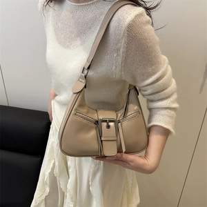 Retro khaki matte leather crescent bag with decorative buckle and zipper detail