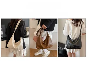 Detailed view of large Hobo shoulder bags in beige, brown, and black soft faux leather