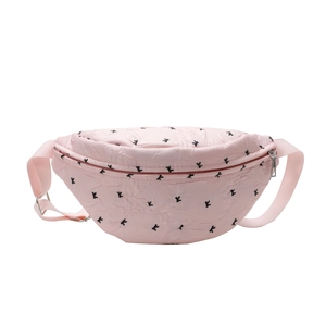 Stylish pink fabric waist bag featuring a black bow pattern and adjustable strap