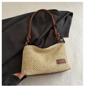 Close-up of the woven texture and premium brown leather base of the shoulder bag