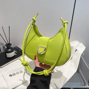 Neon green hobo bag with a silver D-buckle flap and unique knotted rope shoulder strap