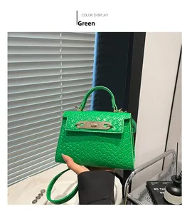 Detailed close-up of bright green woven texture PU leather and gold metal buckle on Kelly bag