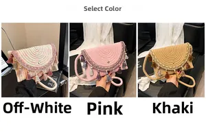 Detailed close-up of colorful ethnic tassels and embroidery on straw woven crossbody bags