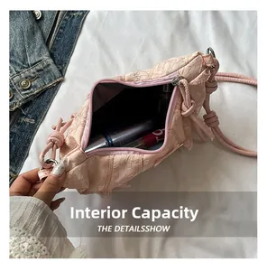 Detailed interior of pink lace moon bag showing space for lipstick and cosmetics