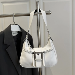 Minimalist white PU leather crescent underarm bag with decorative zippers and metal buckle