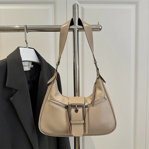 Minimalist beige hobo bag with metal buckle strap and decorative zippers for daily wear