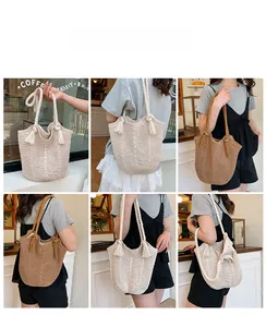 Detail view of woven crochet bucket bag featuring thick cotton rope handles and tassels