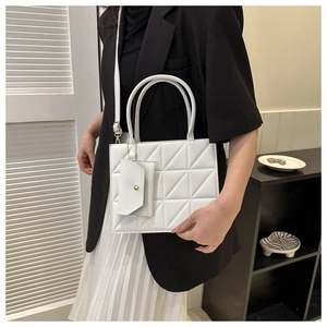 Elegant white quilted leather handbag for women featuring a small matching pouch