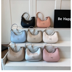 Collection of hobo underarm bags in eight colors with elegant metallic bow details