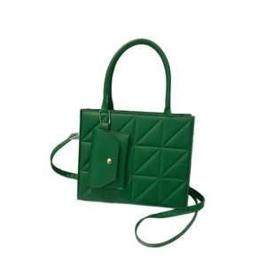 Elegant green quilted handbag featuring a top handle and matching hanging pouch