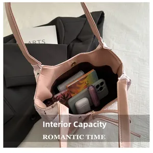 Detailed interior of a pink quilted tote bag showing spacious storage for daily essentials