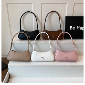 Detailed display of five colors of fashion crescent bags with metal bow decorations
