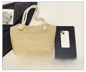 Detailed straw tote bag with V-weave pattern and thick white cotton rope handles