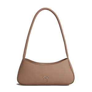 Brown faux leather baguette shoulder bag with silver bow accent and minimalist French design