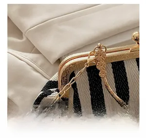 Detail of vintage golden engraved hardware with round handle and elegant metal chain