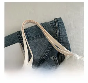 Close-up of elegant lace texture and satin shoulder straps on a white summer tote bag