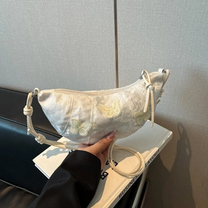 White lace crescent shoulder bag with 3D butterfly embroidery and knotted strap details
