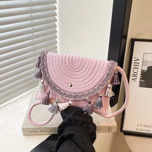 Pink bohemian woven shoulder bag with colorful tassels and ethnic embroidery for summer