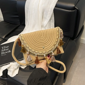Bohemian fringe crossbody bag with beige woven texture and colorful tassel charms