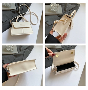 Detail view of cream crossbody bag featuring a woven handle and gold magnetic closure