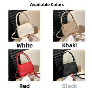 Detail view of small square bags showing white, khaki, red, and black litchi grain textures