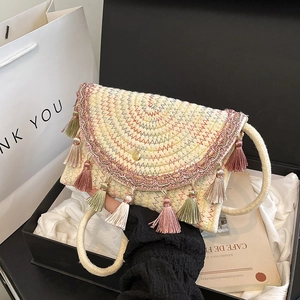 Bohemian handwoven straw shoulder bag with colorful fringe and wave embroidery