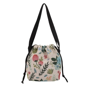 Floral jacquard drawstring bucket bag with a chic vintage flower pattern and strap