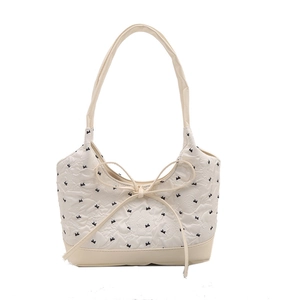Off-white printed shoulder bag with floral embossing and decorative black bow embroidery