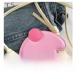 Detailed close-up of pink and beige PU leather bag with premium stitching and texture