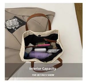 Detailed macro view showing the large internal capacity of the woven straw bucket bag