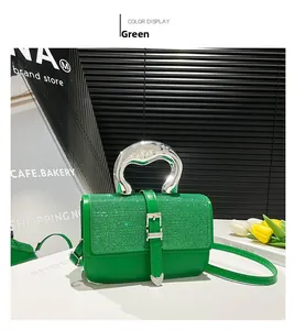 Detail view of the green glitter PU leather surface and unique silver metal handle