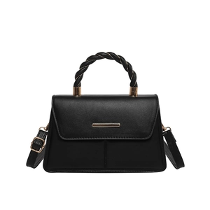 Minimalist black leather square handbag with twisted gold handle and shoulder strap