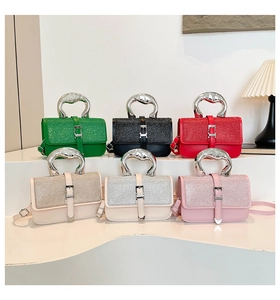 Close-up of luxury handbags with glitter top and silver metal handles in six colors
