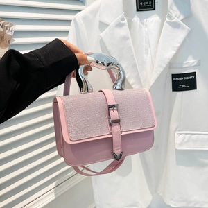 Pink rhinestone handbag with sculptural silver metal handle and matching shoulder strap