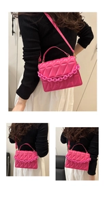 Three-way view of rose red quilted crossbody bag with chunky plastic chain strap