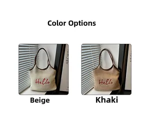 Detail of woven straw bucket bags in beige and khaki with red Hello embroidery