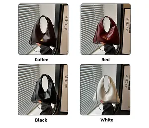 Detail view of stylish hobo bags in coffee, red, black, and white colors with chain
