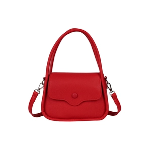 Red lychee grain PU leather saddle bag with top handle and detachable strap on white background