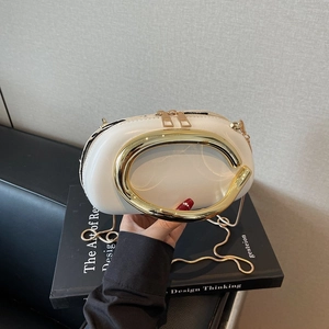 Elegant white oval chain bag with large gold metal handle and dual zipper detail