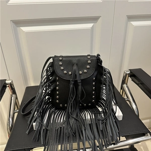Fashionable black tassel crossbody bag with silver studs and pebbled leather texture