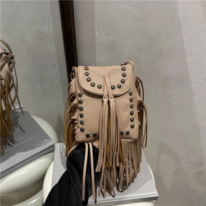 Retro fringed rivet crossbody bag in beige with long tassels and bohemian design