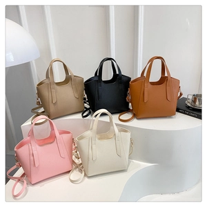 Minimalist bucket bag in five colors showing lychee texture and detachable shoulder straps