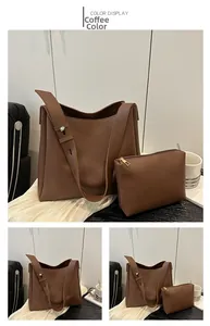 Detail of coffee brown tote bag set with matching pouch and silver metal buckle