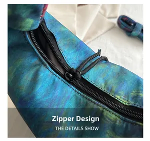 Close-up of smooth zipper closure and gradient star pattern on lightweight nylon bag