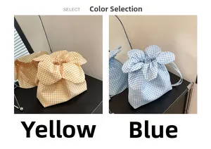 Detail view of yellow and blue plaid drawstring bucket bags with tulip petal design