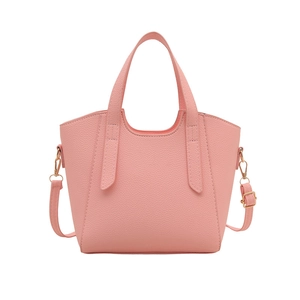 Pink lychee texture leather tote bag with top handles and adjustable shoulder strap