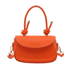 Minimalist orange leather handbag with knot handle design and golden metal strap clips